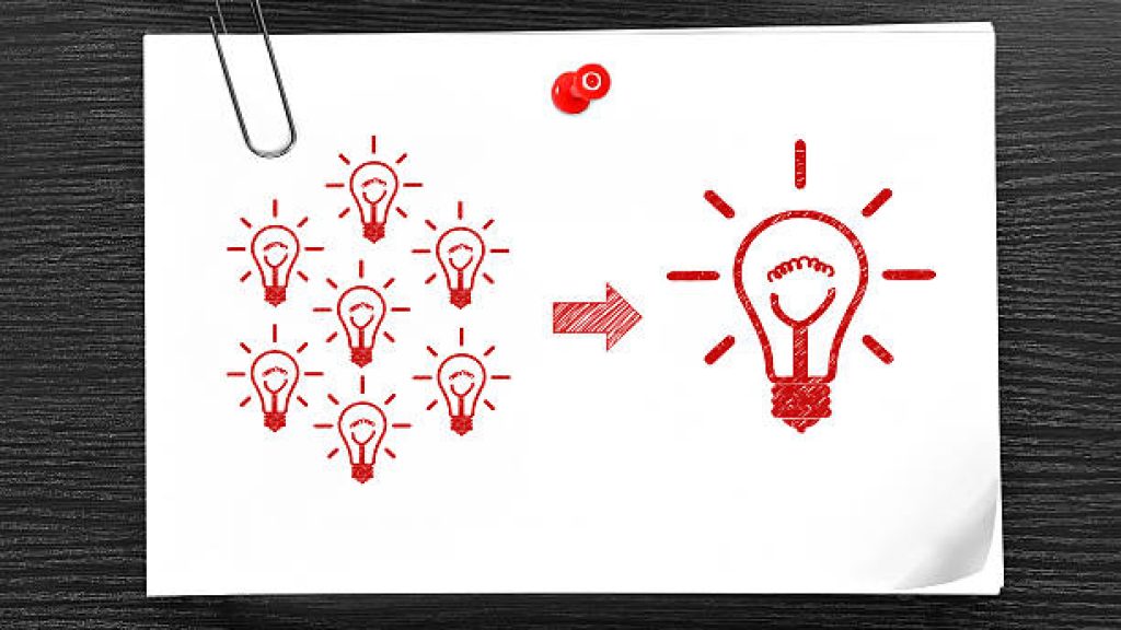 paper with drawing solution attached to wooden wall