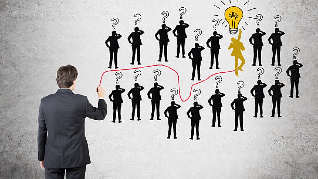 Career development concept with businessman drawing path to leader position
